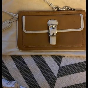 Coach Wristlet gently used condition clean inside.
